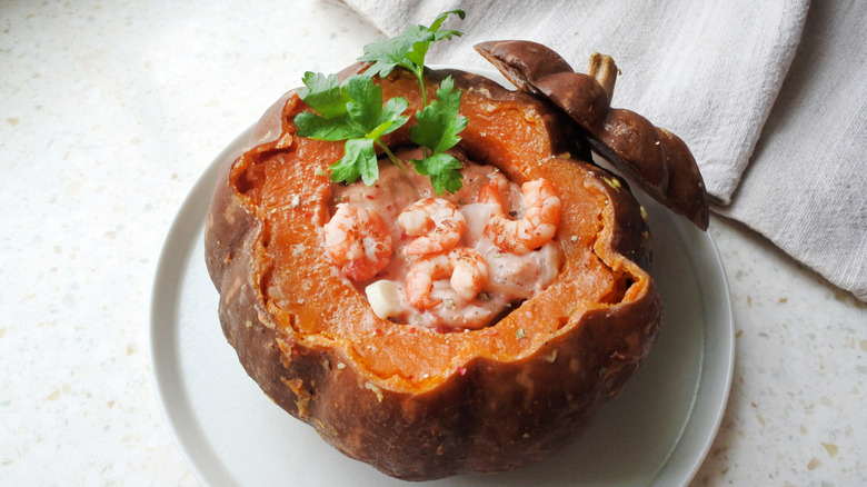 A camarão na moranga dish with shrimp in a pumpkin