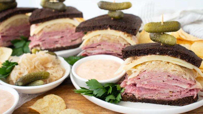 a Reuben sandwich filled with meat and sauerkraut on rye bread