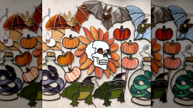 Assorted stained glass Halloween-themed wall hangs
