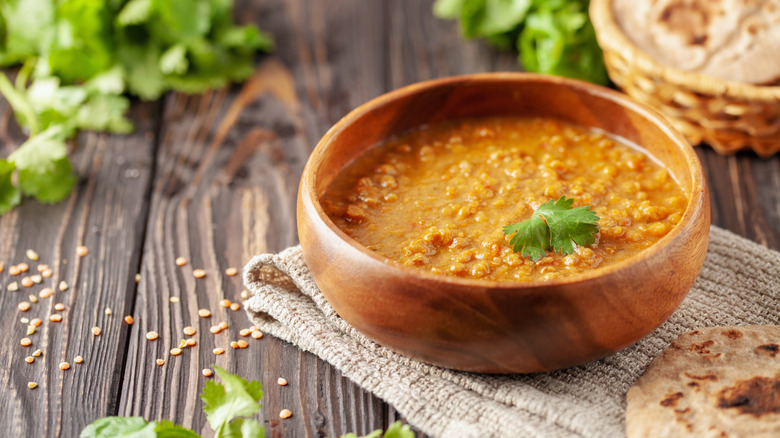 Wooden bowl of Indian lentils