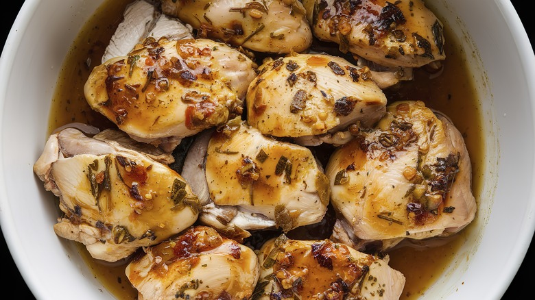 A dish of chicken marinating