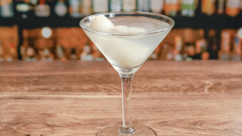 single lychee martini on bar top