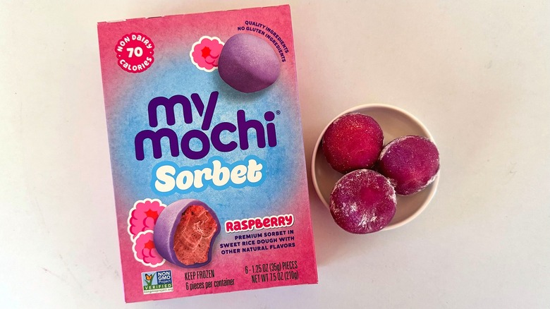 box of My/Mochi Raspberry Sorbet beside small dish with three mochi pieces