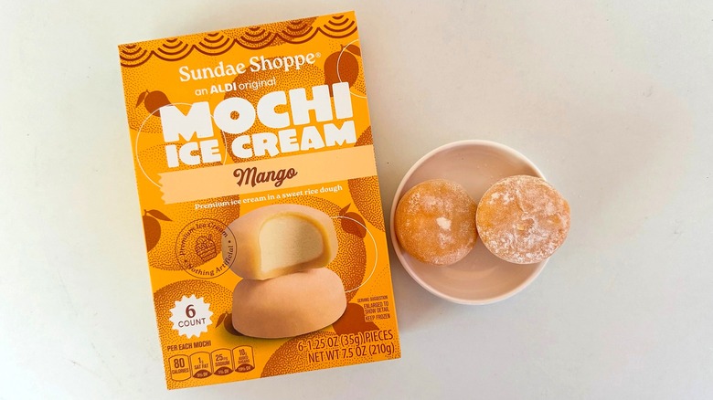 Box of Sundae Shoppe Mango Mochi Ice Cream beside small white dish with two mochi pieces