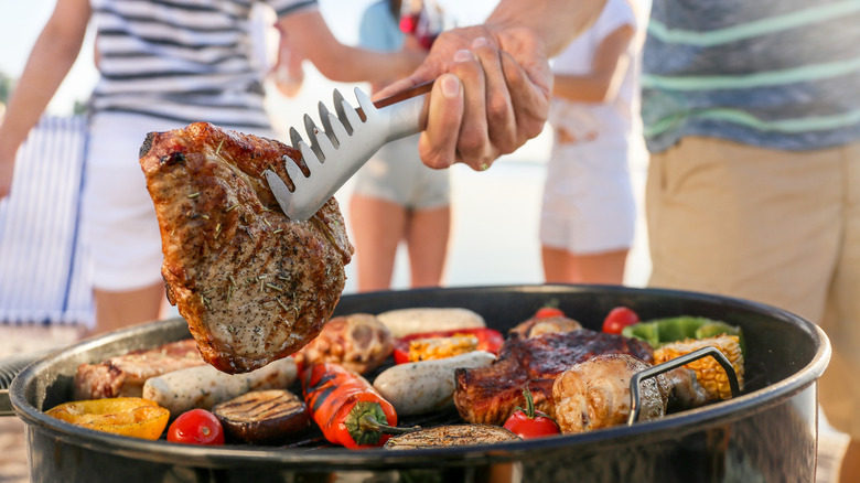 Person cooking food on a grill