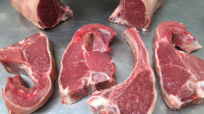 Lamb loin chops on stainless steel surface