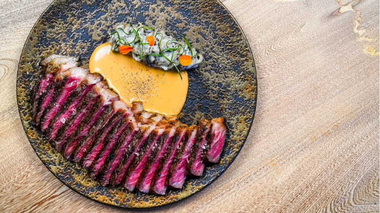 Wagyu bone-in strip steak with butter from Isidore