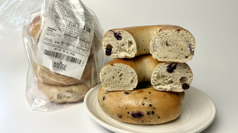 Whole Foods Market Blueberry Bagels, both on a plate and in the original packaging