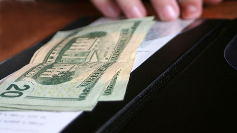 Money on a restaurant check