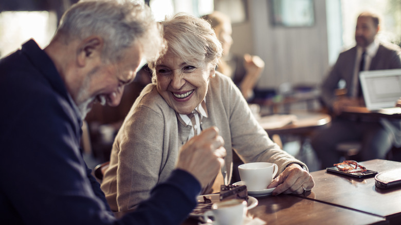Older people drinking coffee in a restaurant