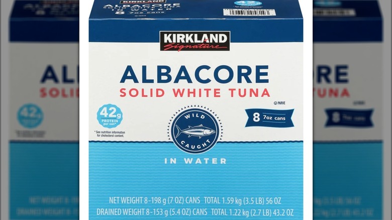 A box of Kirkland Signature solid white tuna cans