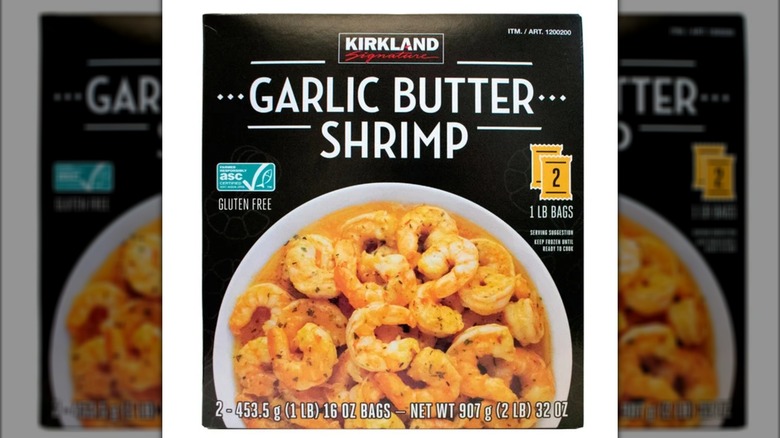 A container of Kirkland Signature garlic butter shrimp