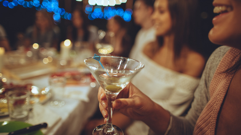 Woman sipping martini