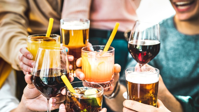 Friends holding various drinks