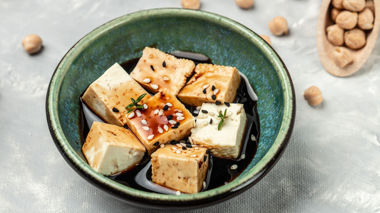 tofu marinating in a bowl