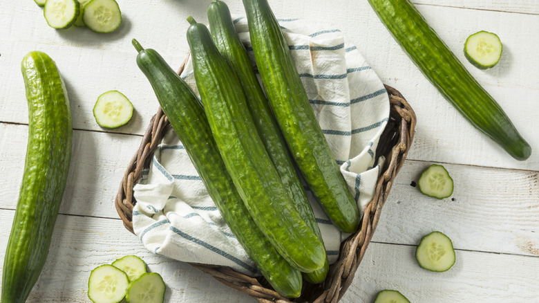 A pile of English cucumbers in a basket