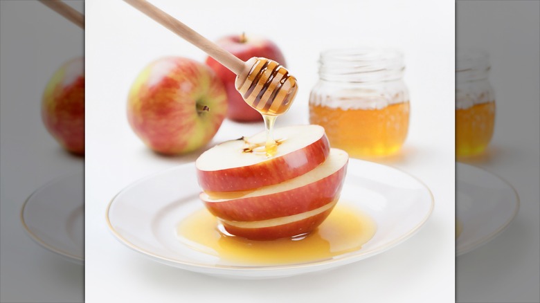 Sliced apple and honey