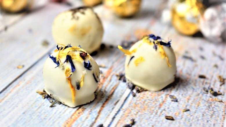 White chocolate truffles sit on a table
