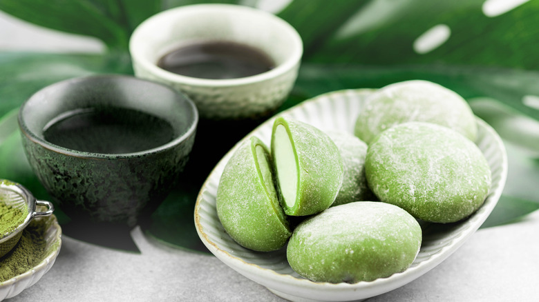 matcha mochi filled with cream with tea