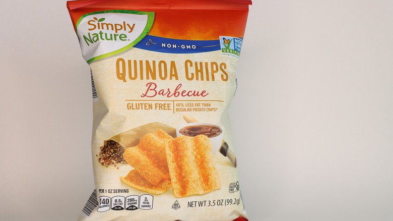 Bag of SimplyNature BBQ quinoa chips on plain background