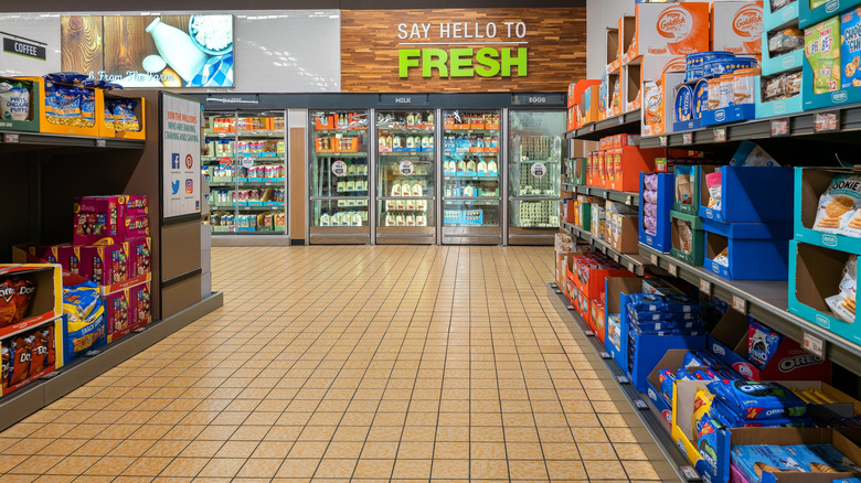 Wide aisle at Lidl looking toward the dairy refrigerator cases