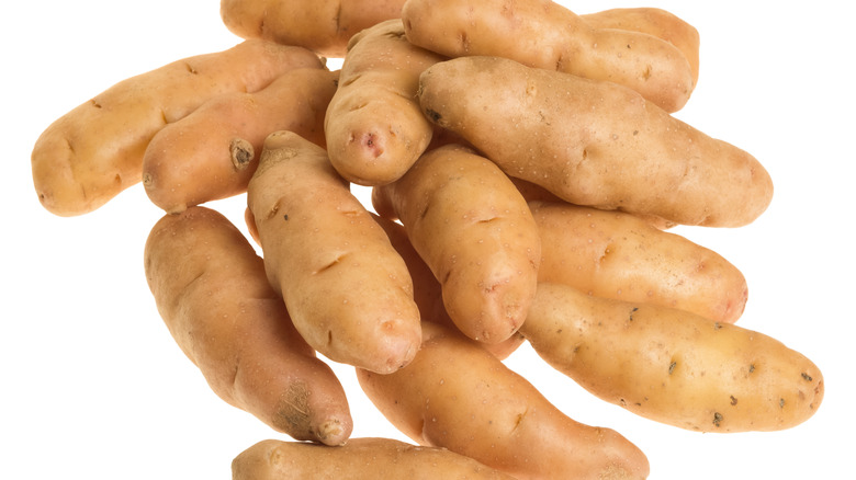 Fingerling potatoes on a white surface