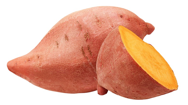 One sweet potato and a half on a white background