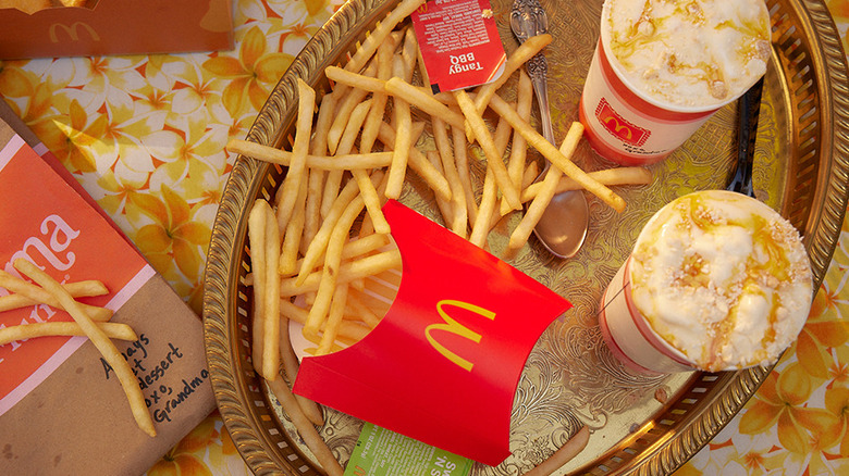 Two cups of McDonald's Grandma McFlurry and fries on platter