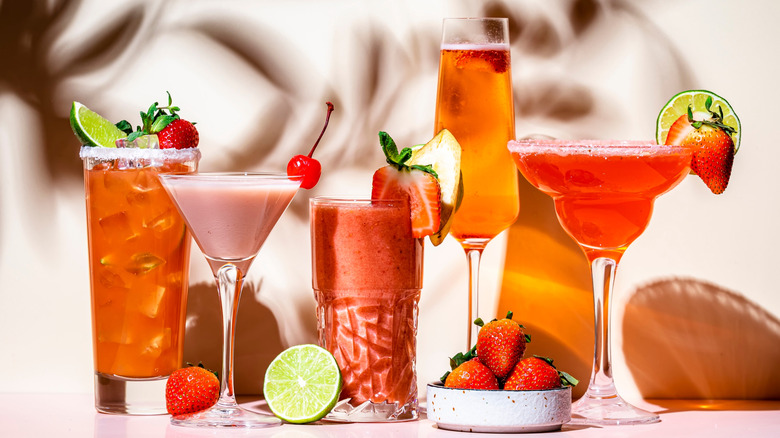 A row of assorted strawberry cocktails