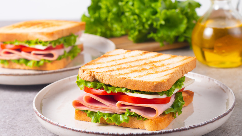 Close up of turkey sandwich with lettuce and tomato
