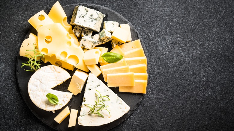 Cheese platter on a black circular slate