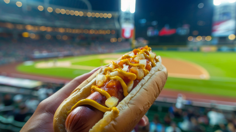 a baseball stadium hot dog smothered in condiments