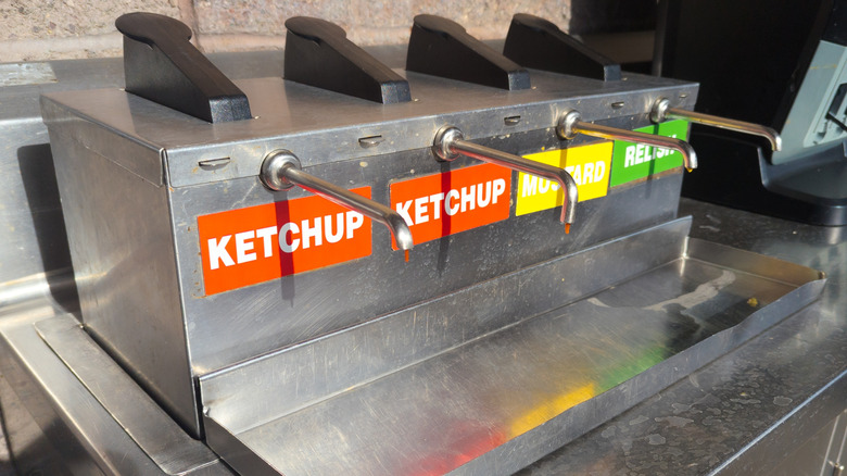 a condiments bar with ketchup, relish, and mustard