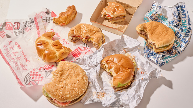 Half eaten burgers on a table
