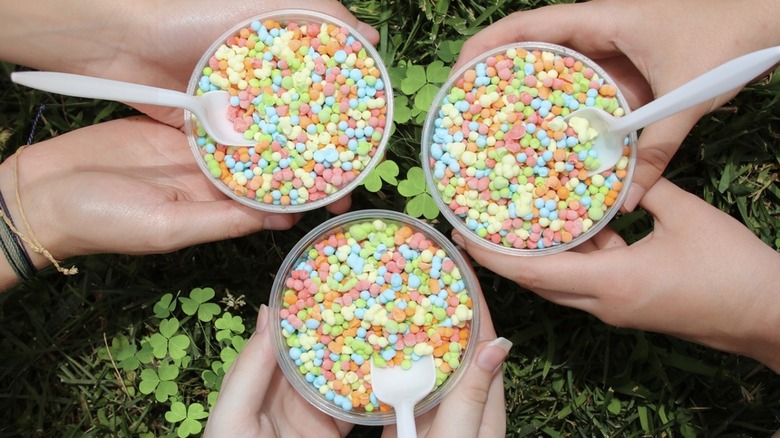 Three cups of rainbow Dippin' Dots.
