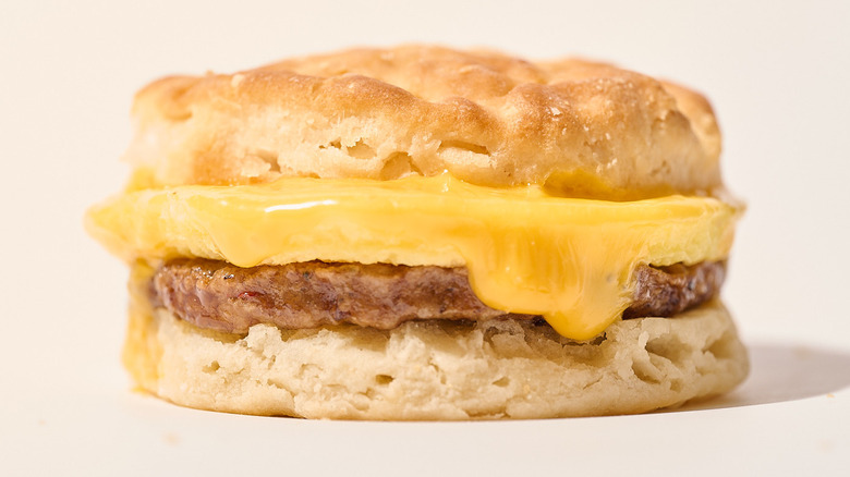 sausage biscuit sandwich on a table