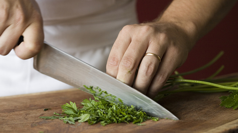Person cutting food with a kitchen knife