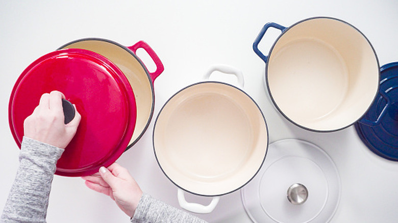Enameled Dutch ovens on white background
