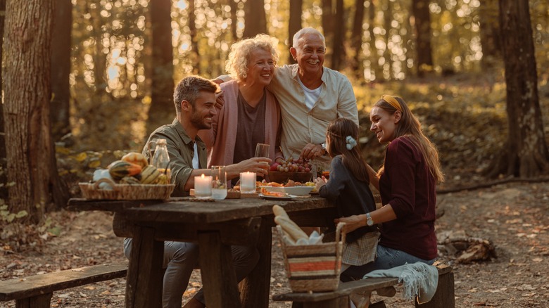 Family sitting at picnic table