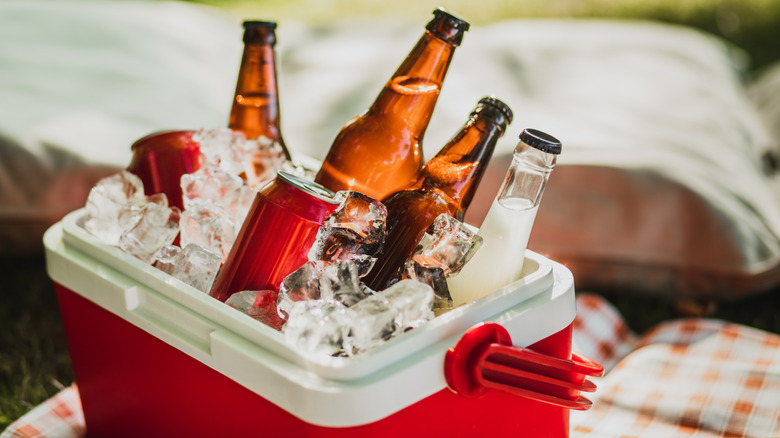 Red cooler full of drinks