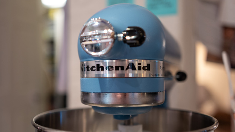 Close up of a KitchenAid blue stand mixer