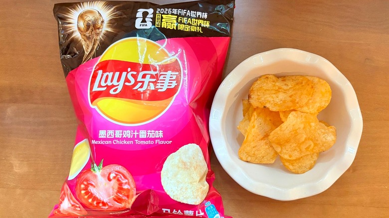 pink Mexican Chicken Tomato chip bag next to a white bowl of chips
