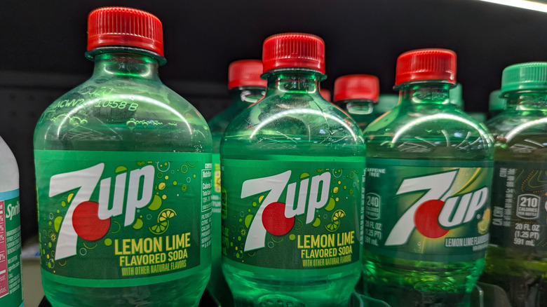 Bottles of 7-Up on shelves