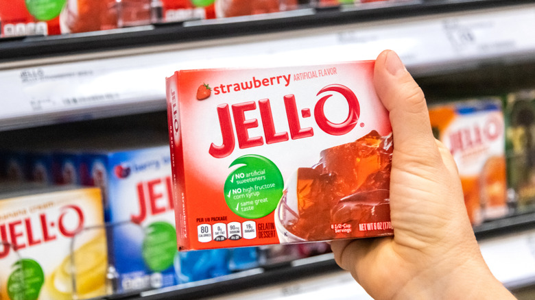 Hand holding pack of Jell-O