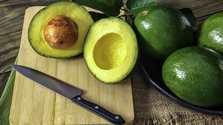 Sliced avocado on board
