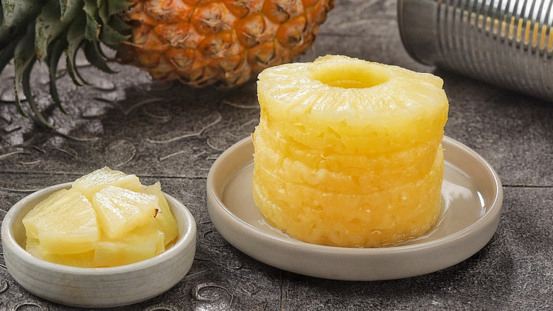 Pineapple rings on plate with can in background