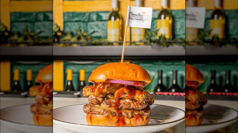 A burger with a Bareburger flag in it from Bareburger