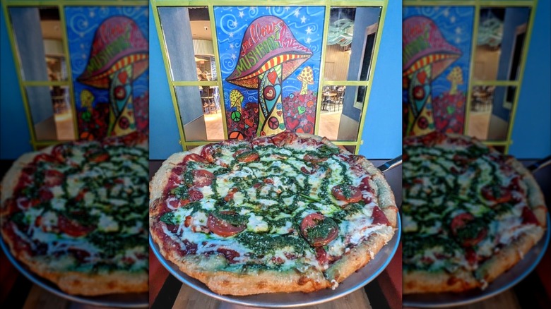 Mellow Mushroom in front of the sign