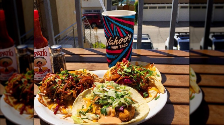 Plate of Wahoo's Fish Tacos and a cup