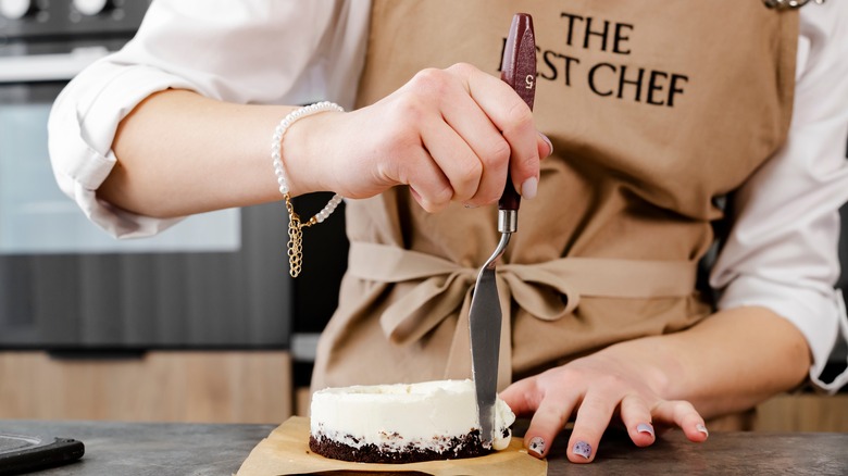 Woman using offset spatula 
